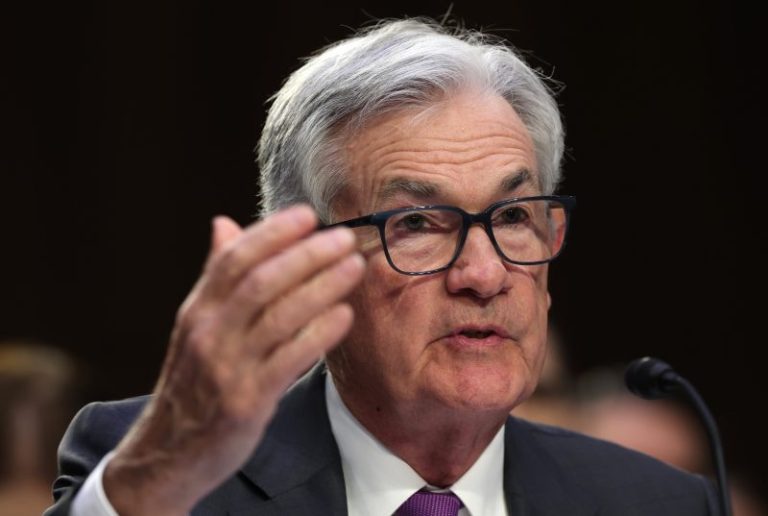 Jerome Powell says Fed is likely to speed up interest rate hikes if the economy keeps roaring