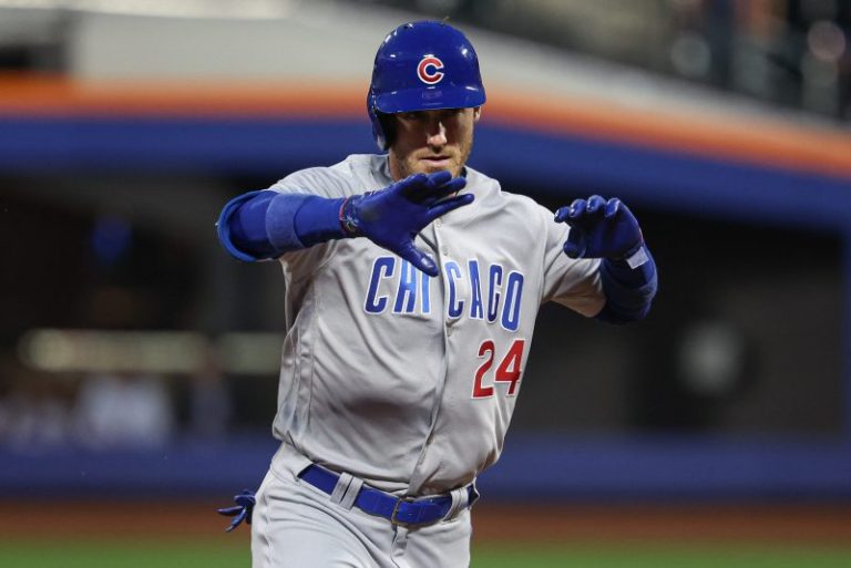 Former NL MVP returns to Cubs on three-year contract