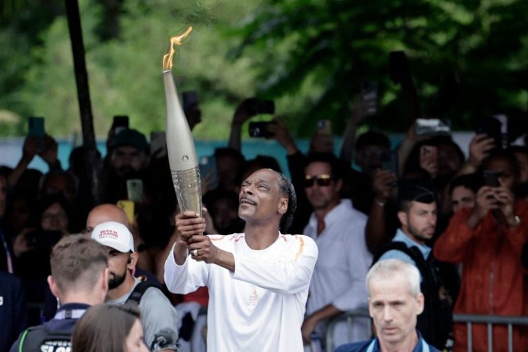 Snoop Dogg carries Olympic torch ahead of Paris opening ceremony