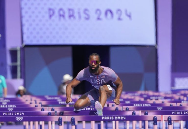 Why did US hurdler Crittenden jog through his heat Sunday?