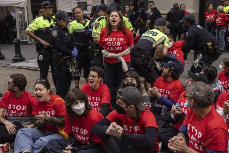 Protesters stage sit-in outside New York Stock Exchange to spotlight Gaza attacks