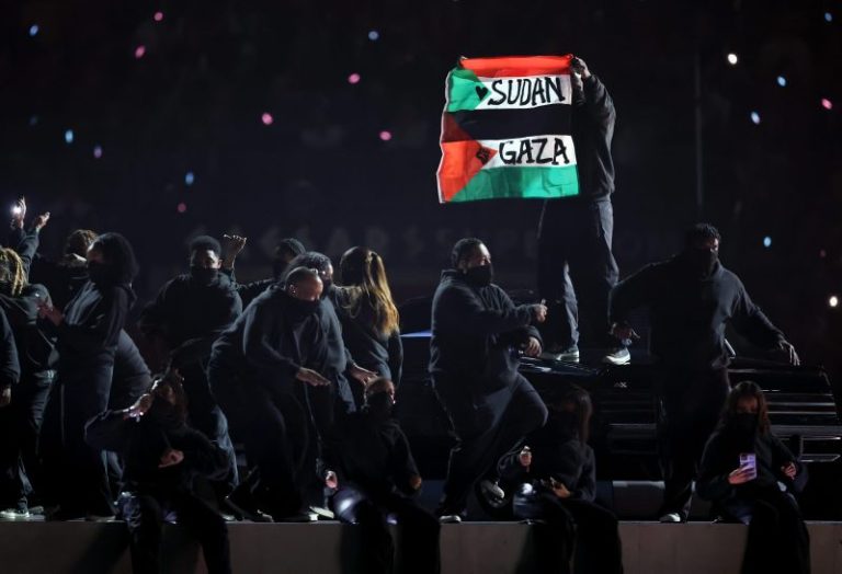 SB halftime performer banned from NFL events after waving flags in protest