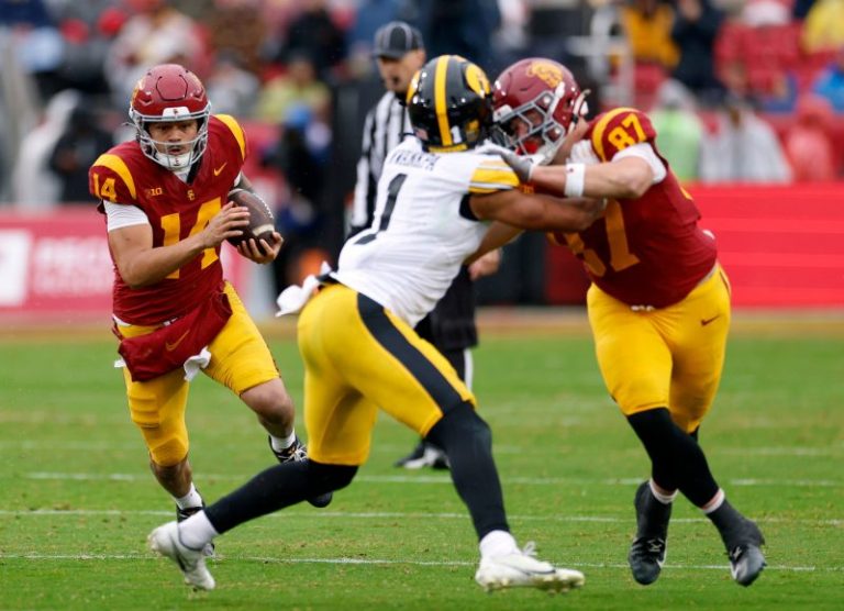 USC keeps CFP hopes alive with comeback win over Iowa